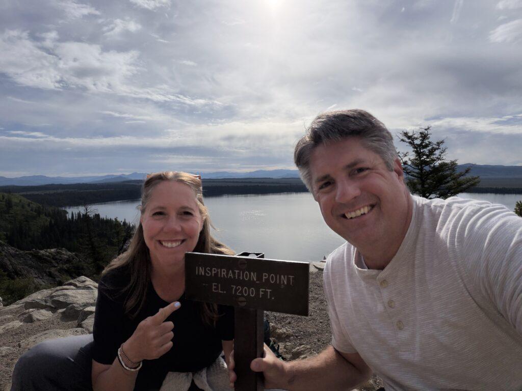 man and woman at Inspiration point-lake overlook