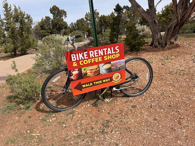 bike rental & coffee shop sign on bicycle