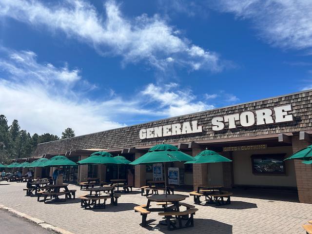 general store with tables and umbrellas out front