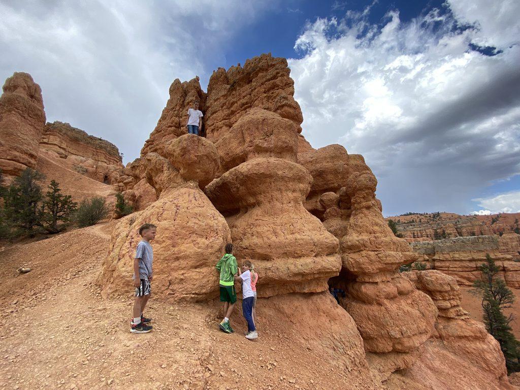 kids playing on hoodoos