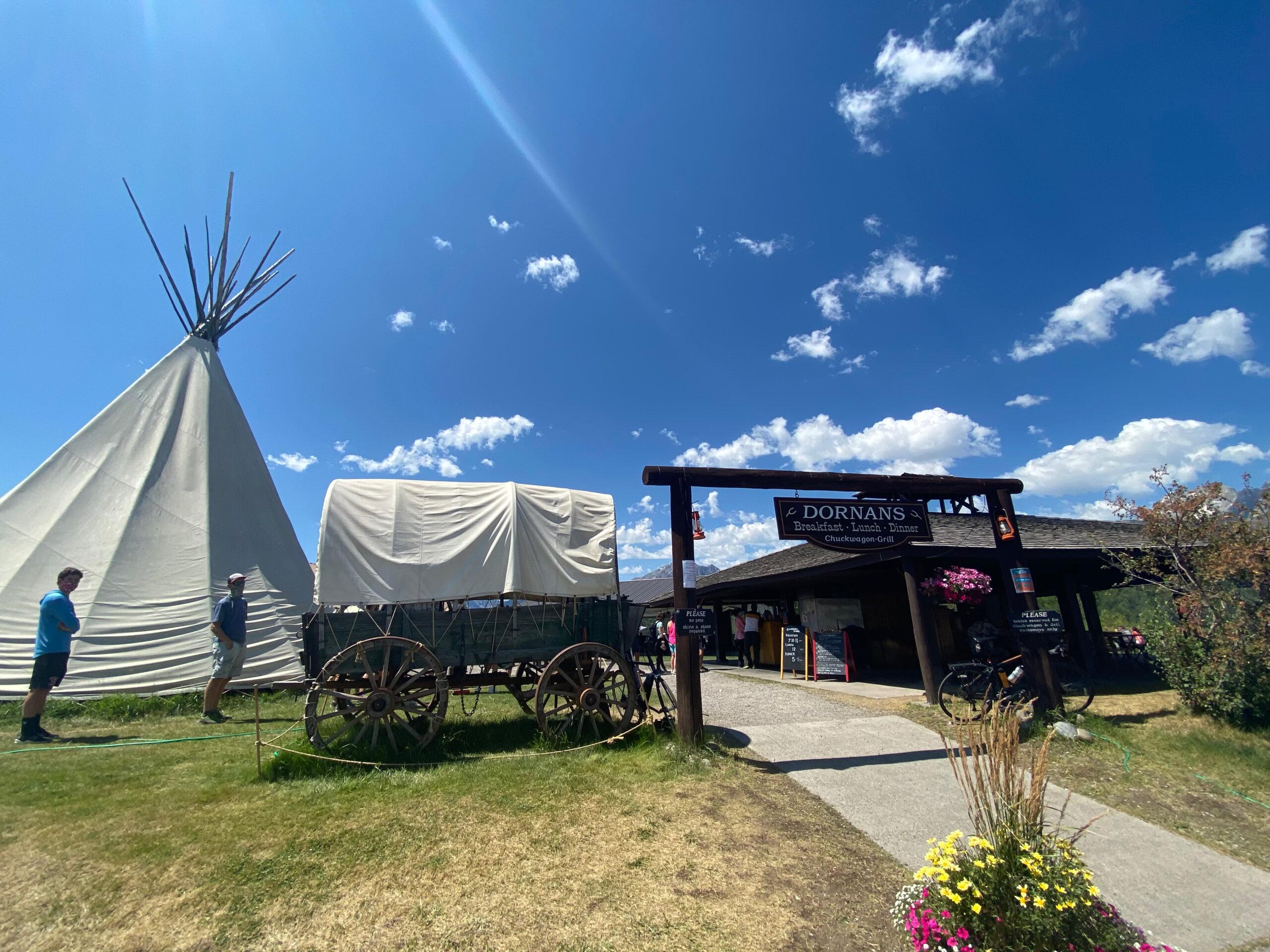 teepee and covered wagon at entrance to Dornans