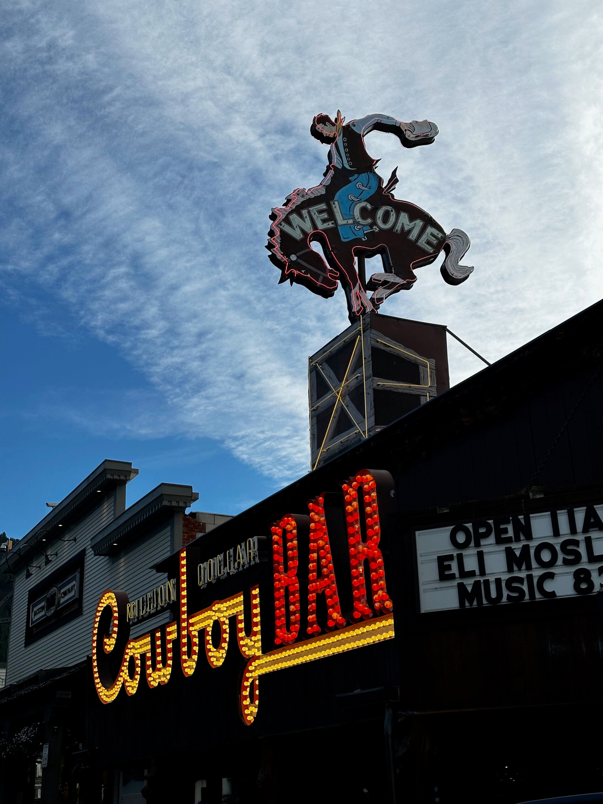 The bucking bronco sign on top of the Cowboy Bar