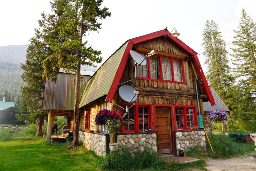 log cabin with red frame