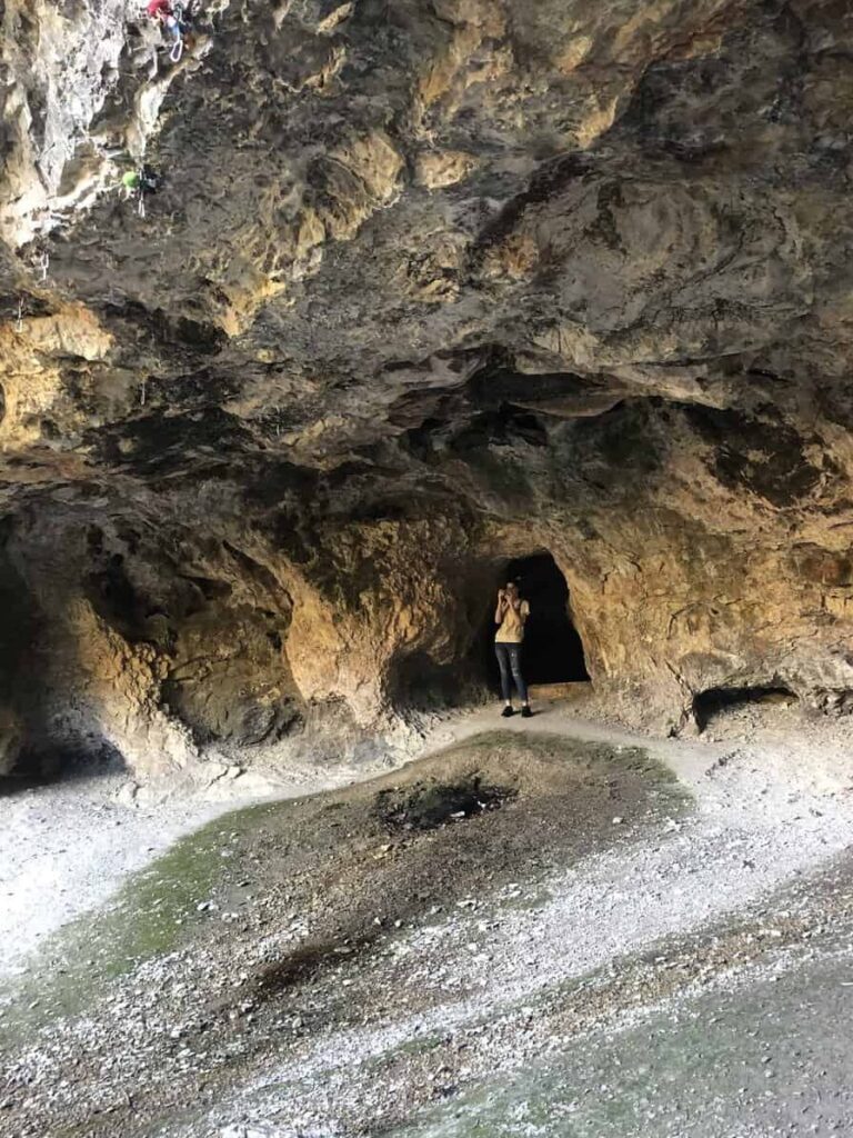 person standing in cave