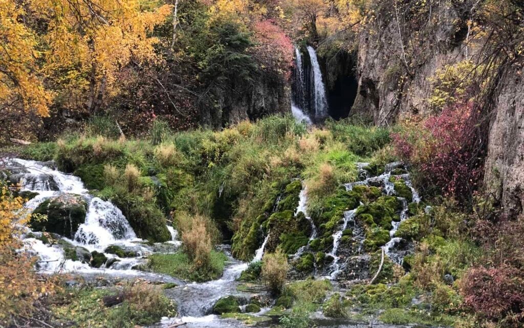 waterfall among fall leaves