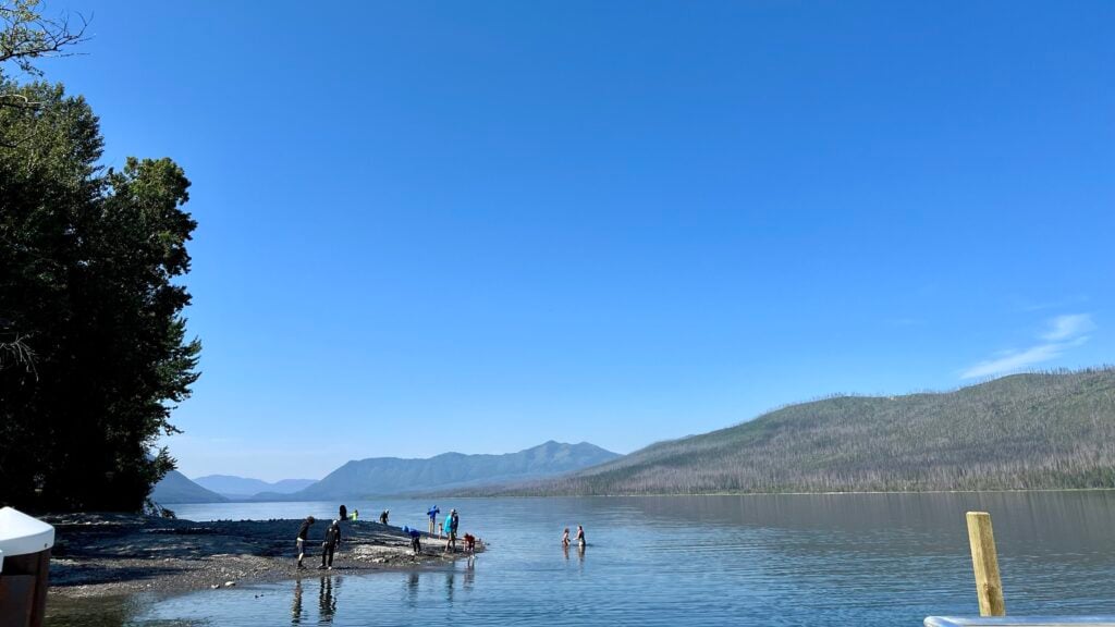 visitors swimming in a lake