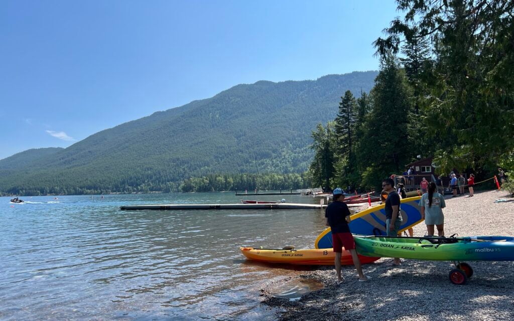 Visitors putting kayaks in the lake