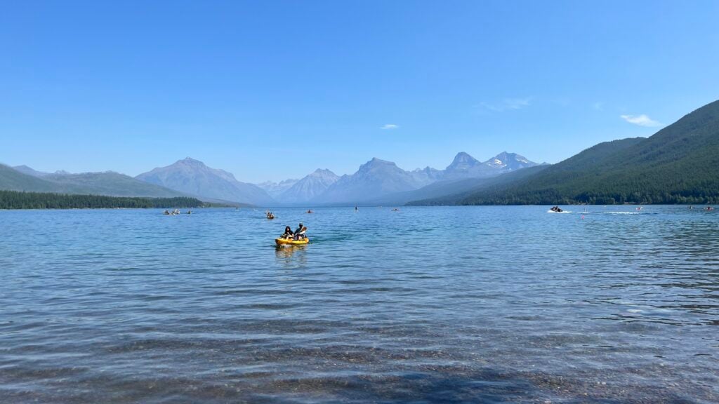 visitors kayaking on a lake