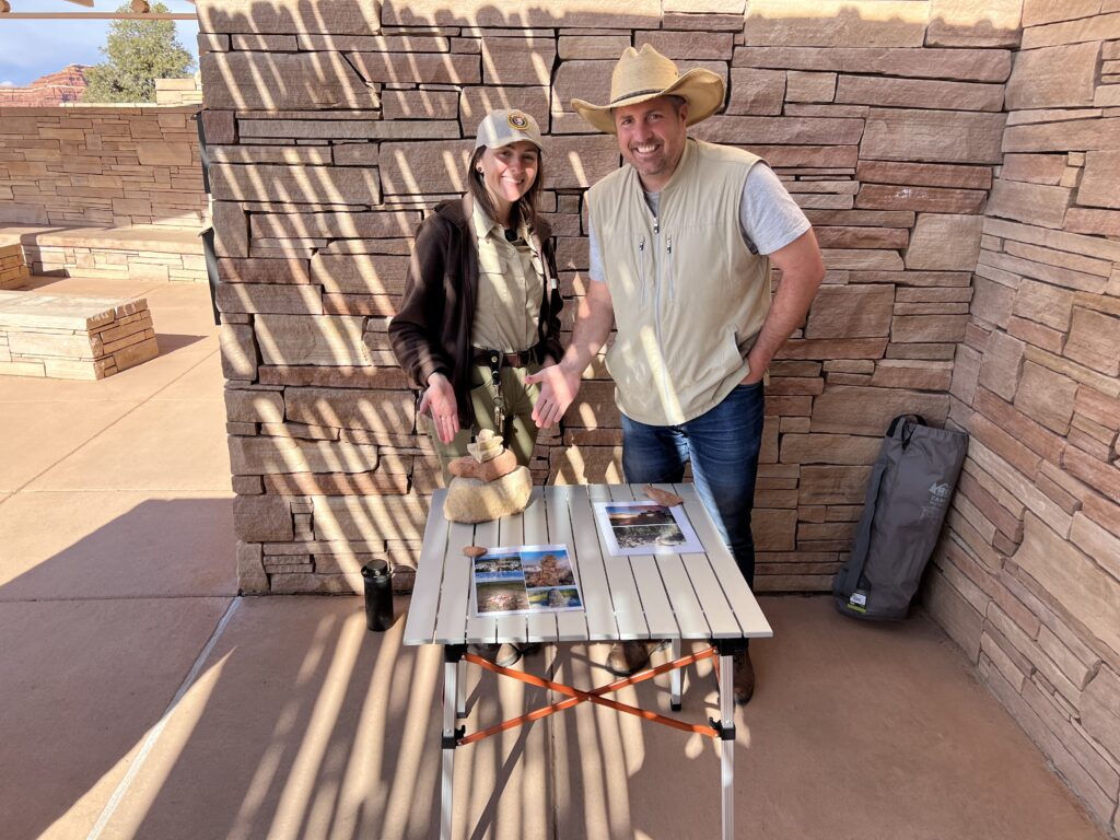man with ranger at visitor center display