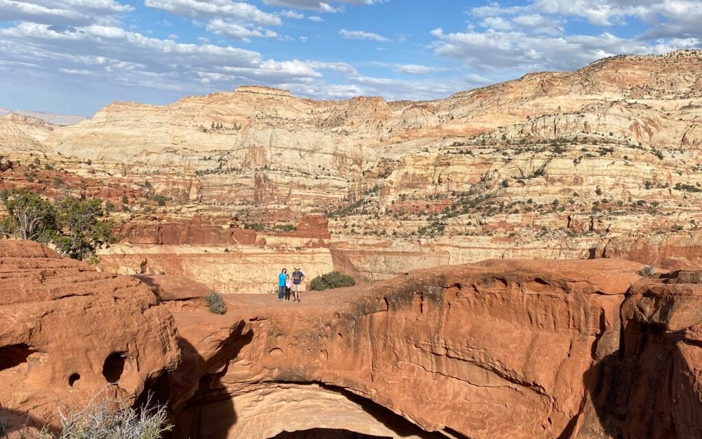 people standing on arch