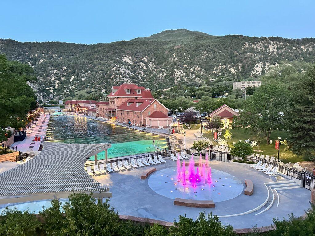 view of Glenwood Hot Springs building, pool, and splash pad