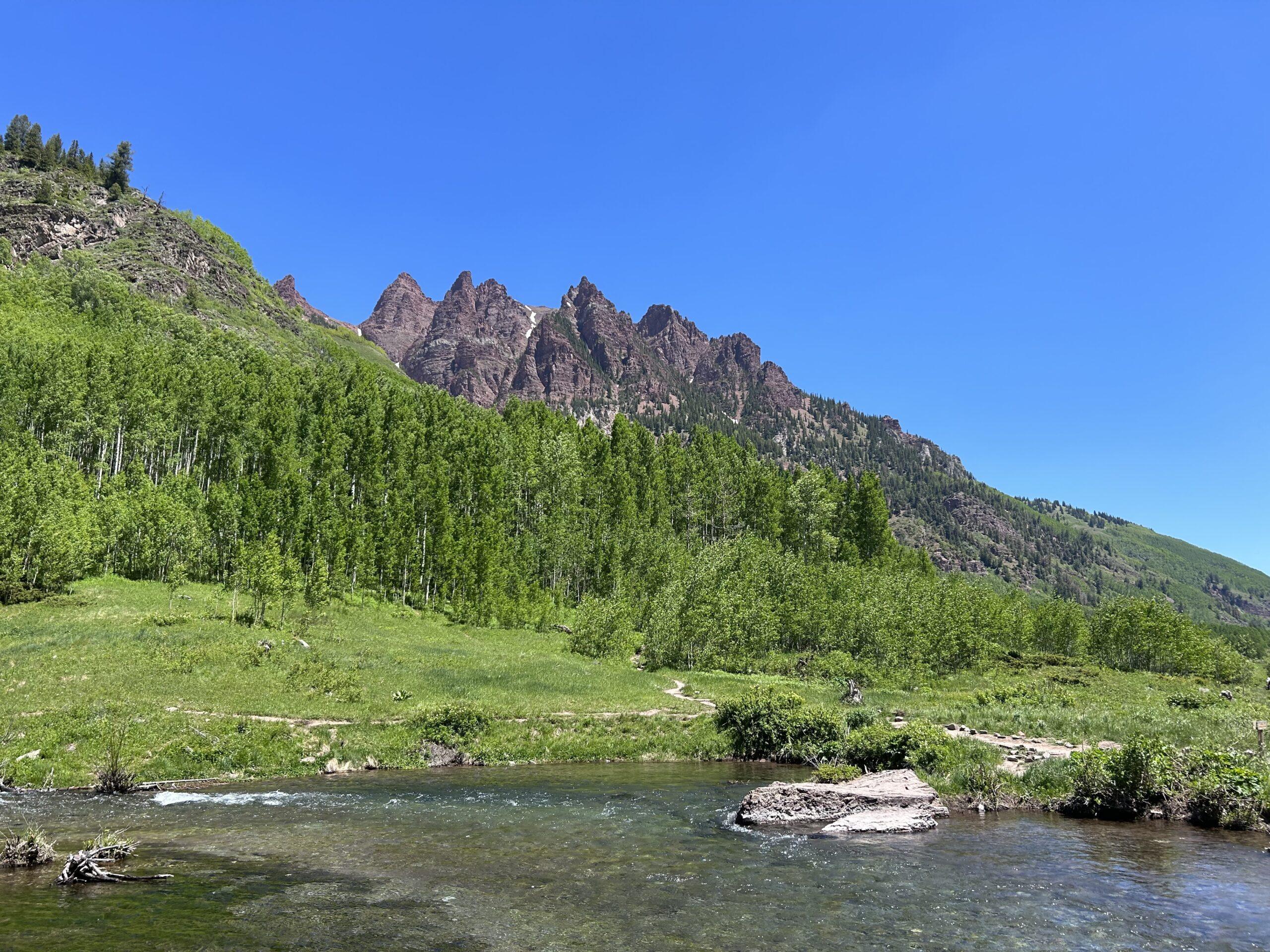 mountain peaks behind lake