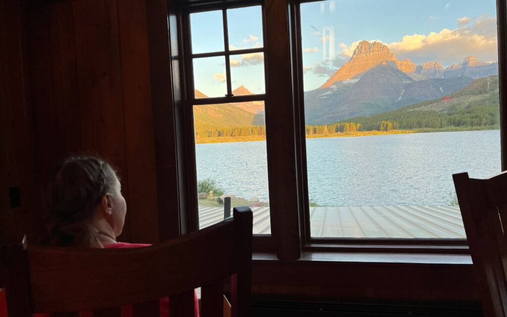 woman looking out window in ptarmigan dining room