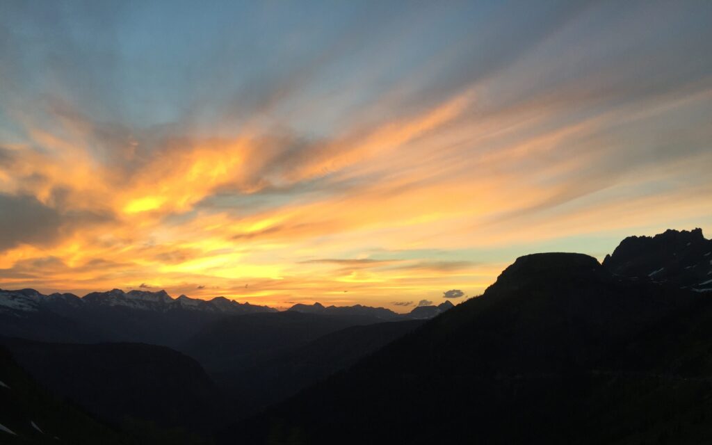 Glow in the clouds of sunset west side of Going-to-the-Sun Road Glacier
