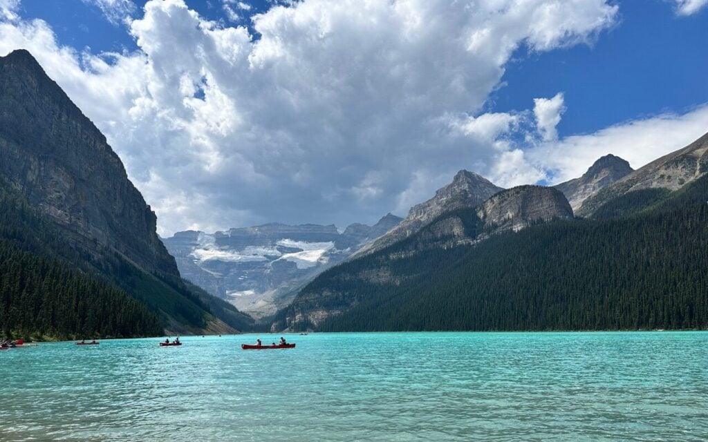 View of Lake Louise with canoe in Banff