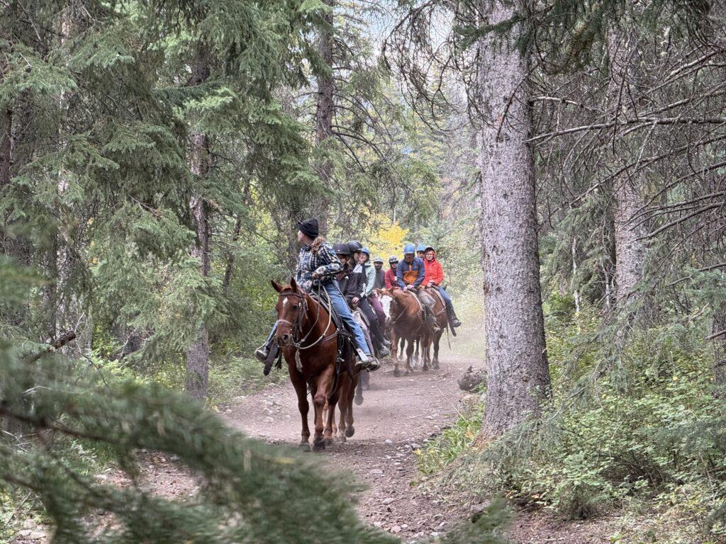 people riding horses in Banff
