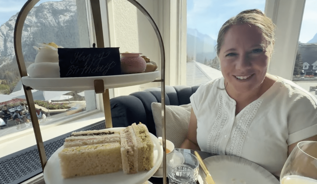 woman at dining table having tea