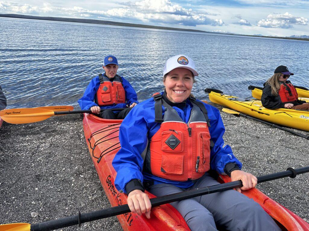 Woman and child in Kayak on the beach of Yellowstone Lake