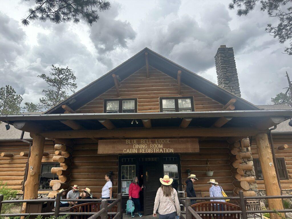 Front of Blue Bell Lodge with people walking on porch
