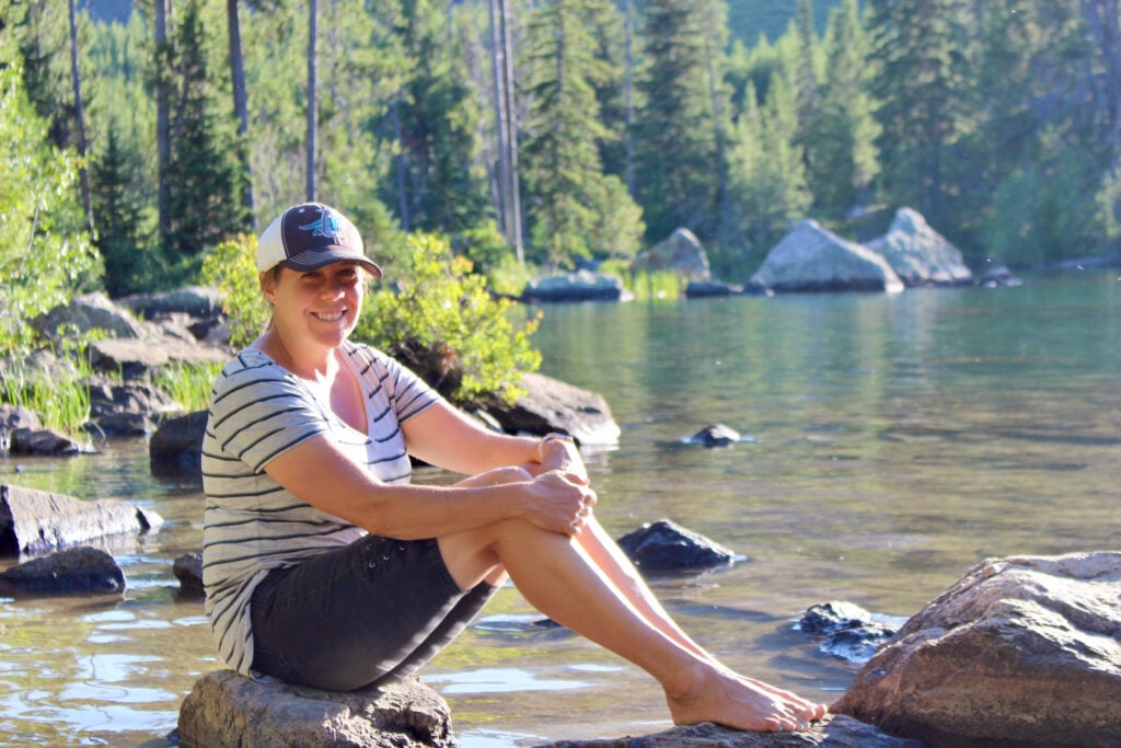 Woman in front of lake