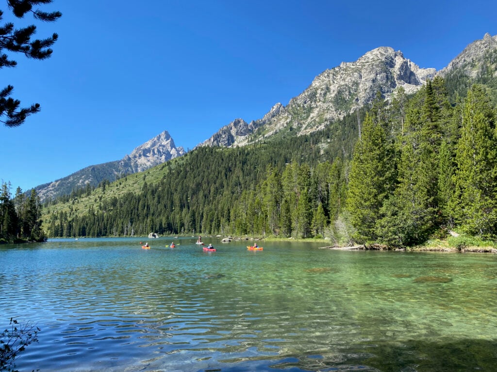 people rafting on lake