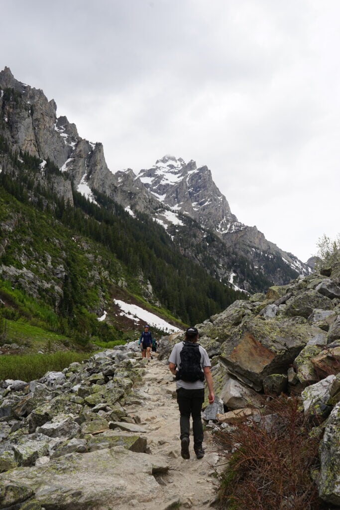people hiking in canyon