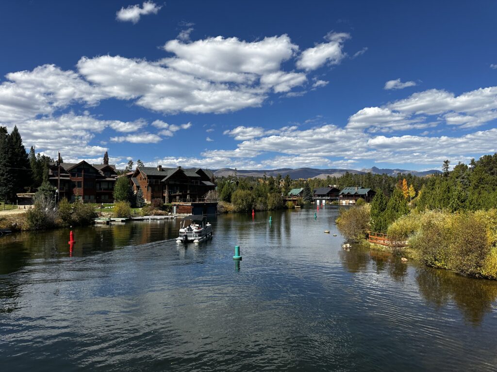 Waterway with buoys and a pontoon boat