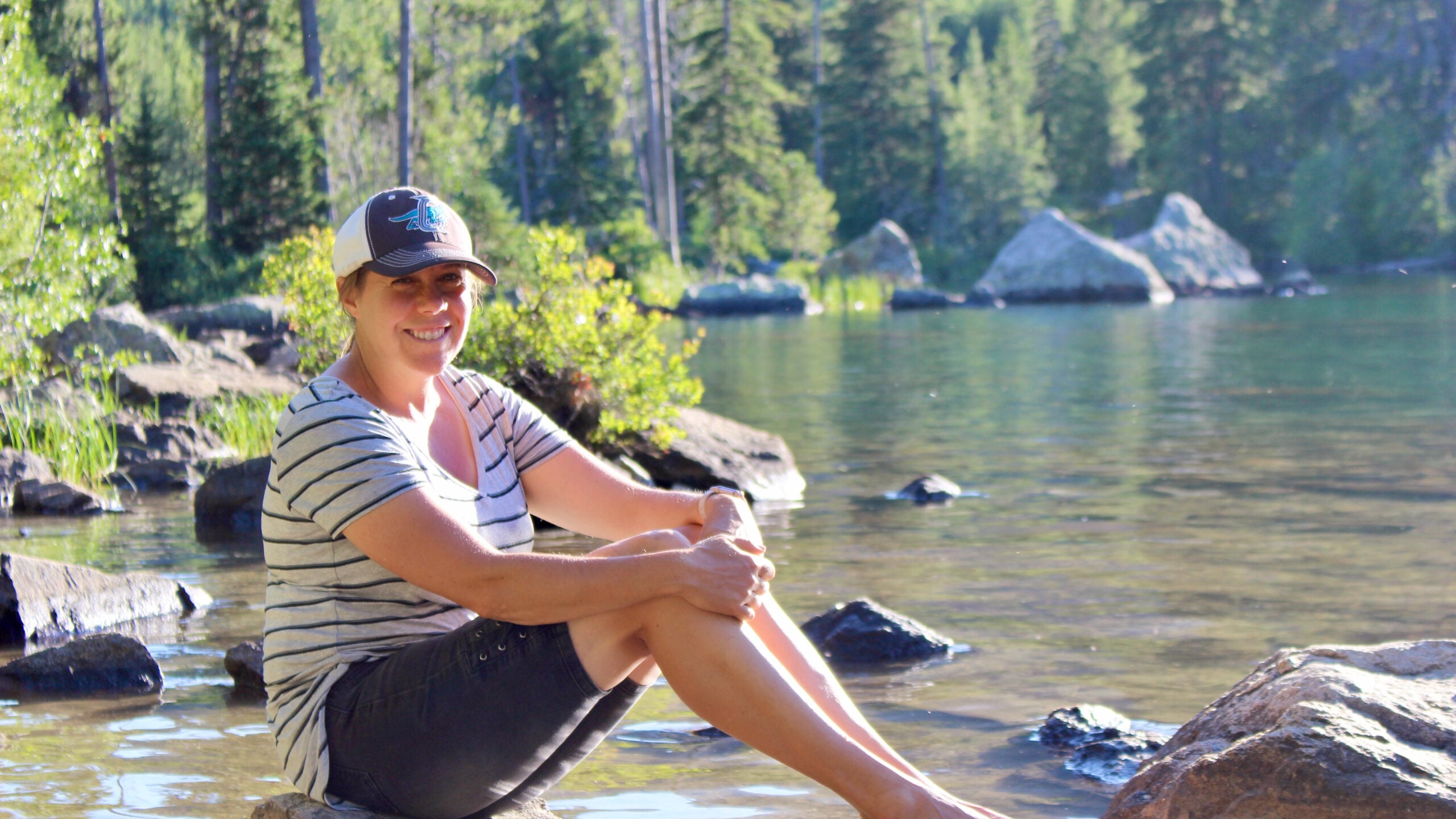 Woman in front of lake