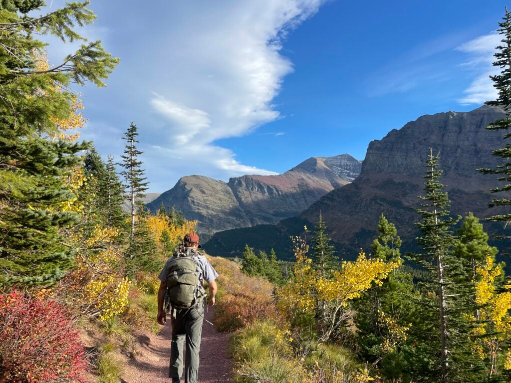 Hiker on a trail in Glacier National Park