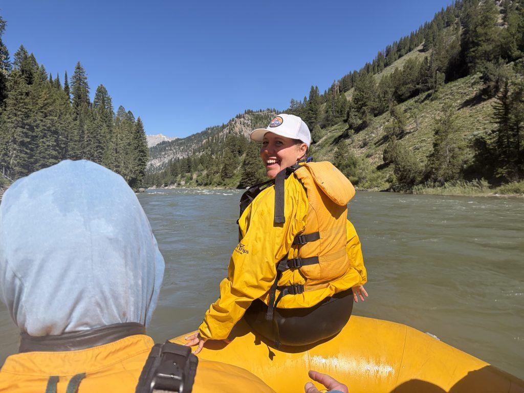 woman on front of raft on river