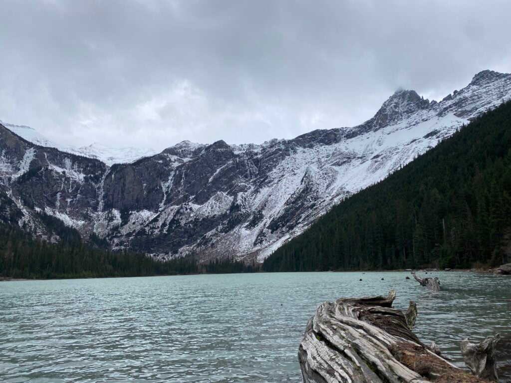 Avalanche Lake with snow-covered mountains