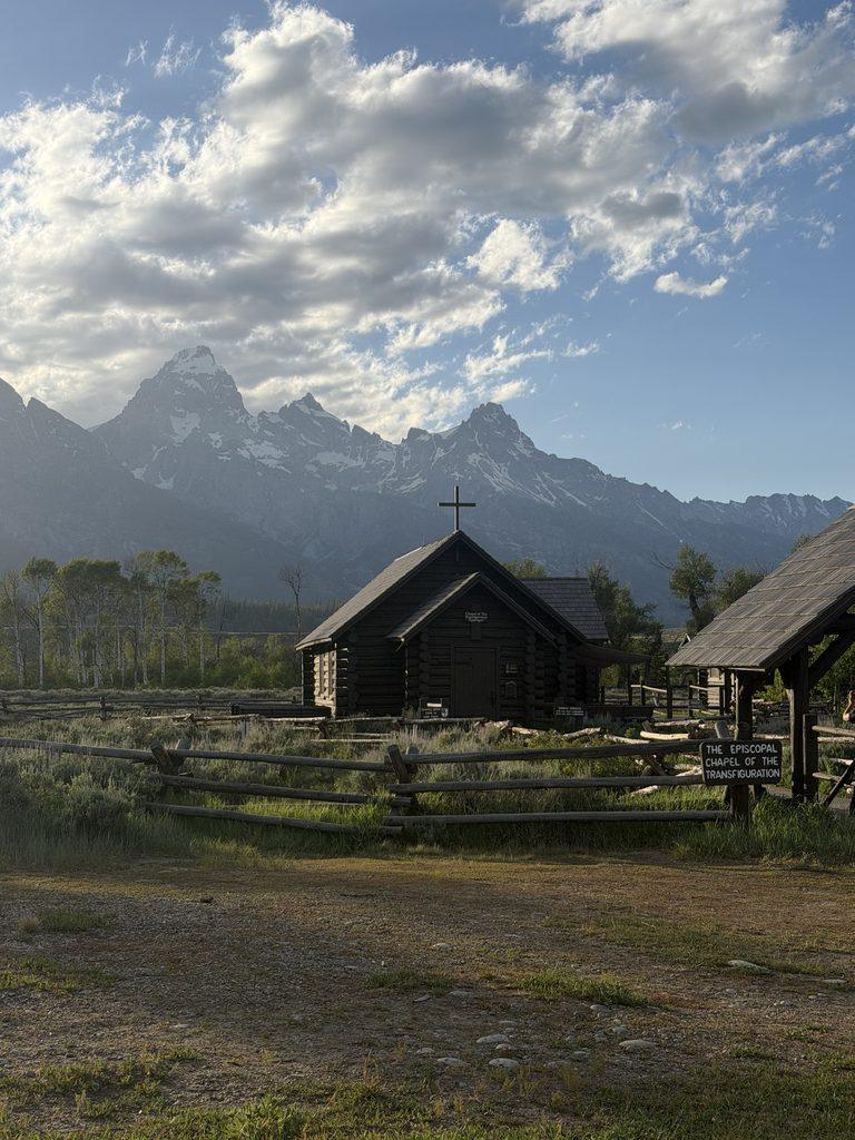 small church below Teton Mountains