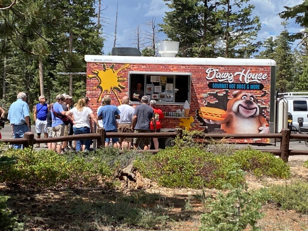 people standing in line at food truck
