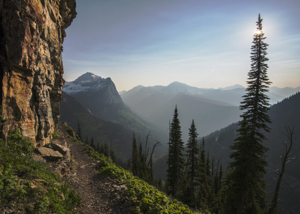 trail along mountain edge with mist