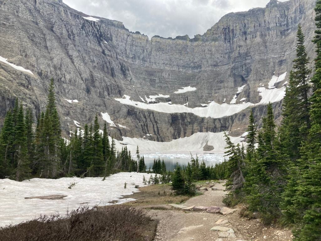lake with icebergs with glaciers surrounding