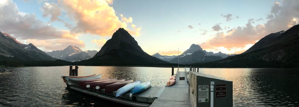 boats on duck at sunset in Many Glacier