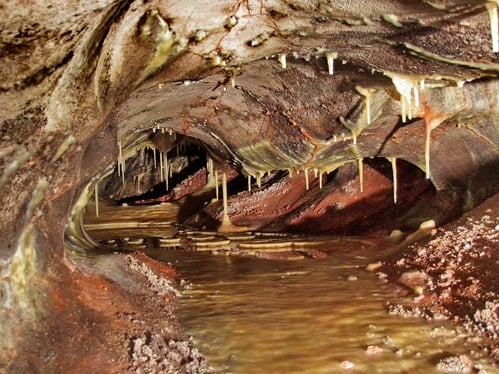 stalactites and lake in cave