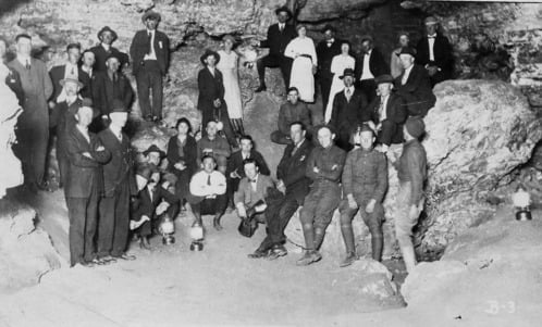 historical photo of people in cave