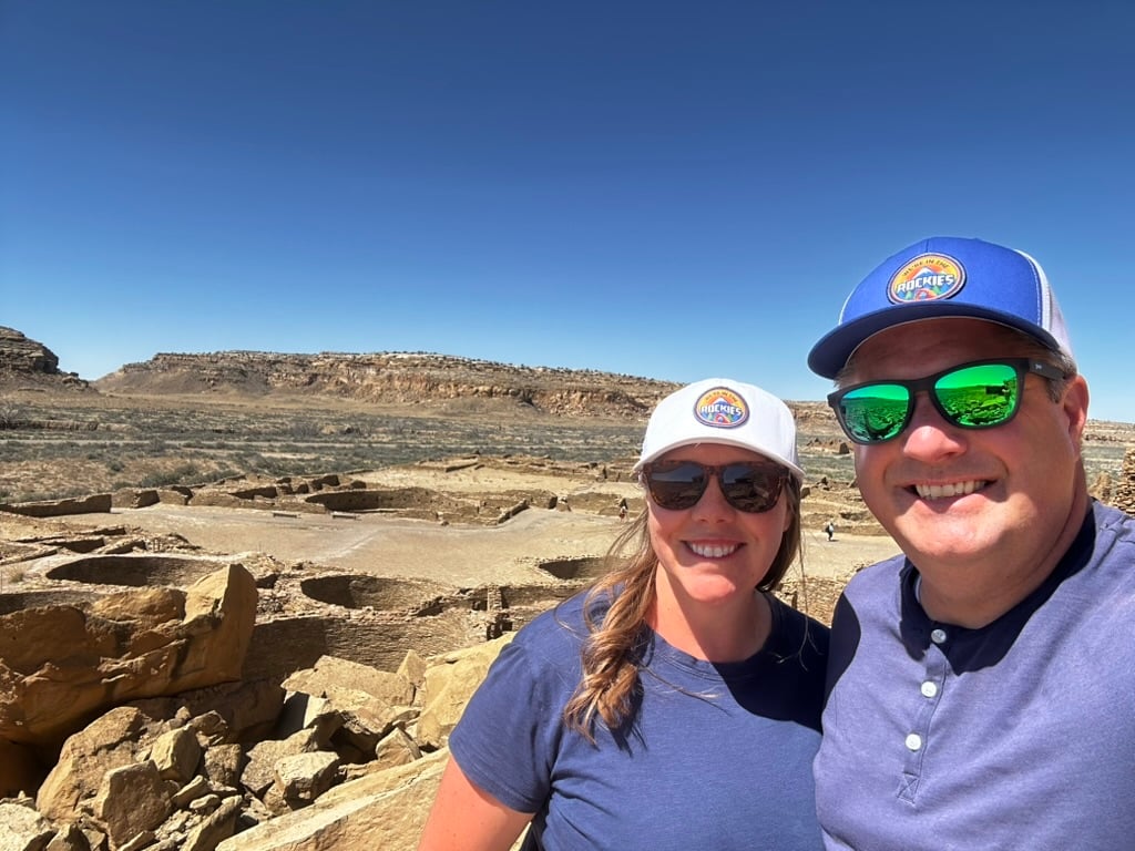man and woman in front of Ancestral Puebloan Ruins