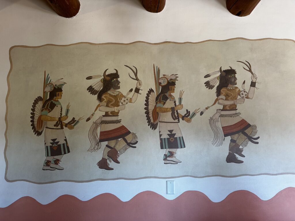 Four native americans in a mural inside a restaurant