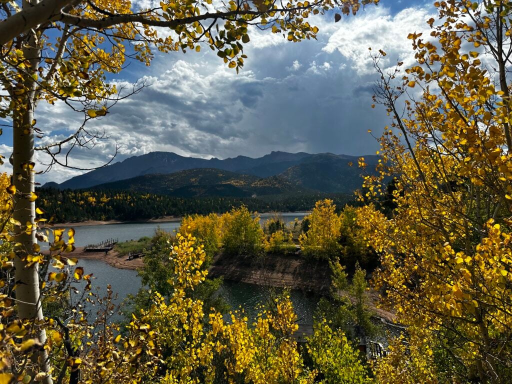 Golden apsen trees infront of a lake