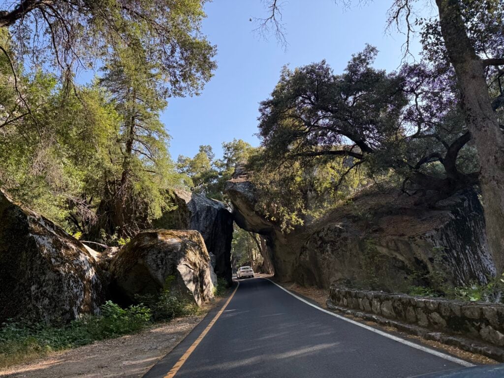 car driving through Arch Rock