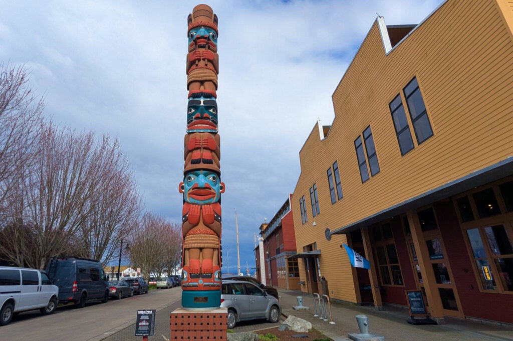 totem pole in front of building