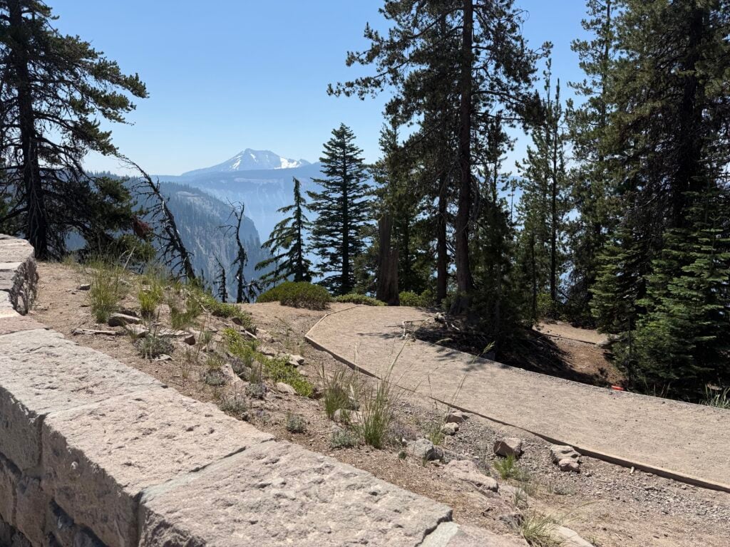 Flat, packed dirt trail with mountain in the background
