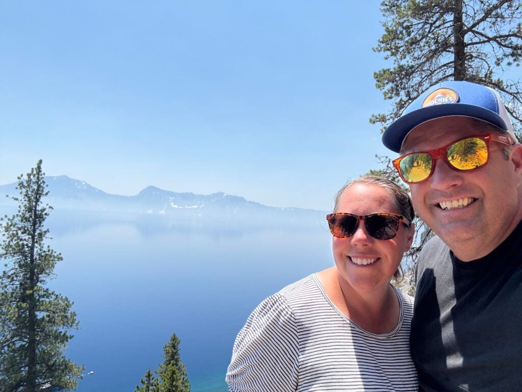 Man and woman with Crater Lake in the background