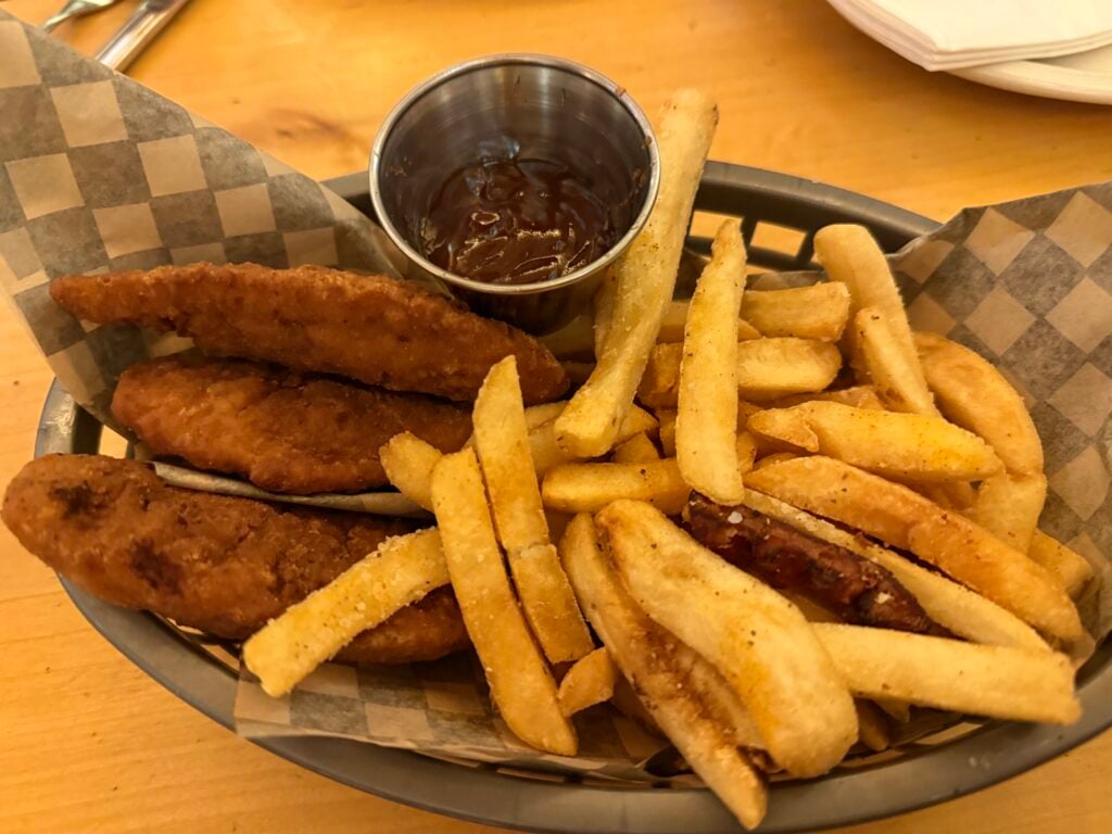 Chicken strips, fries, and bbq sauce