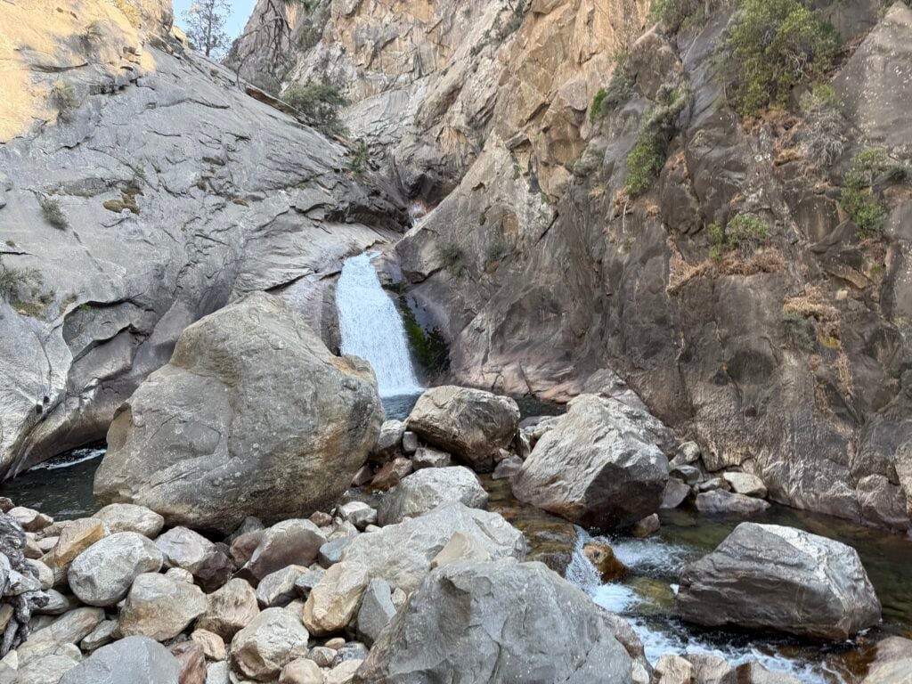 Waterfall with boulders around it