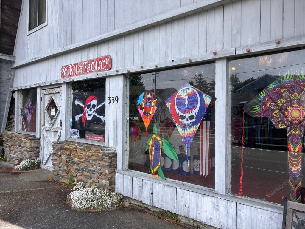 front of kite store with kites in windows
