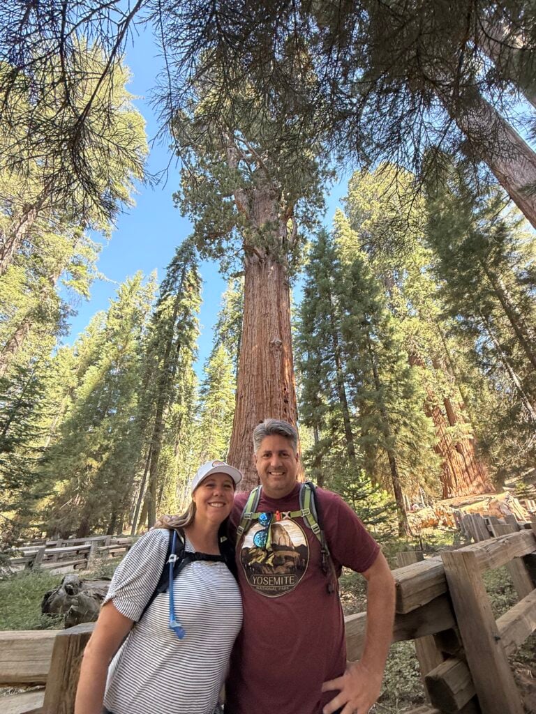 Man and woman standing in front of the General Sherman Tree