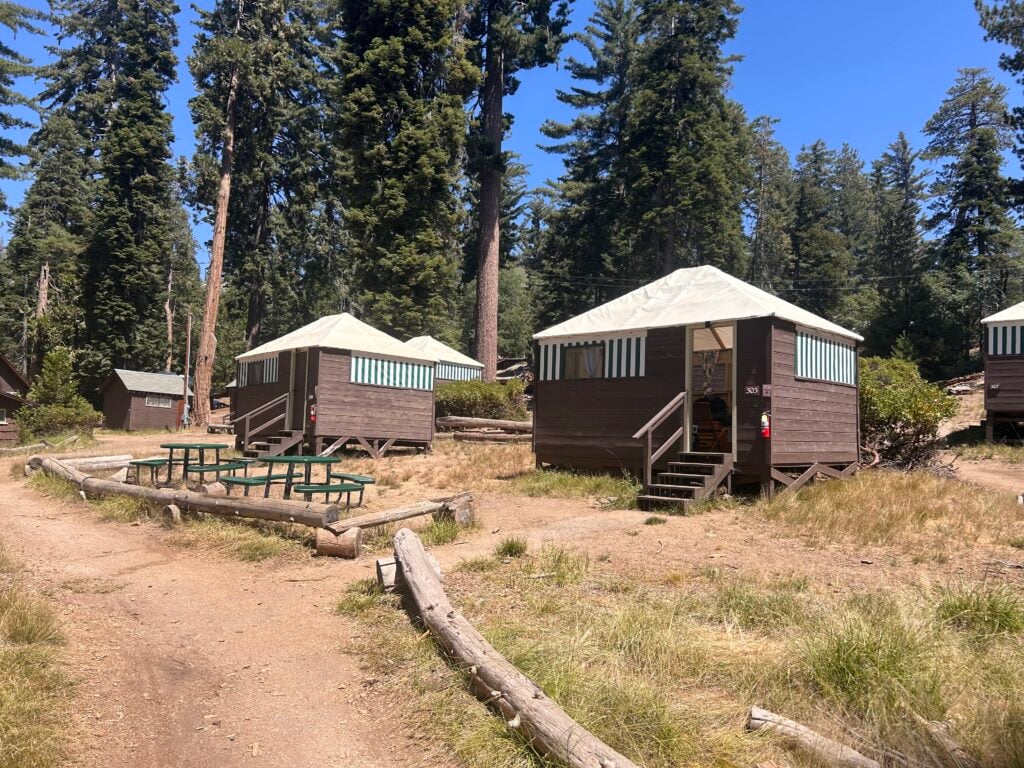 Small wooden cabins with canvas tops